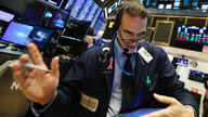Late burst of buying on Wall Street leaves indexes mixed