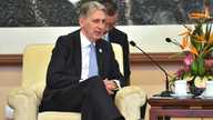 The Latest: Hammond says Britain a good Belt & Road partner
