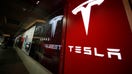 FILE- In this Feb. 9, 2019  file photo, a sign bearing the company logo is displayed outside a Tesla store in Cherry Creek Mall in Denver.  A new automatic lane-change feature of Tesla’s Autopilot system doesn’t work well and could be a safety risk to drivers, according to tests performed by Consumer Reports. Senior Director of Auto Testing Jake Fisher said in a statement Wednesday, May 22,  that the system doesn’t appear to react to brake lights or turn signals, and it can’t anticipate what other drivers will do.  (AP Photo/David Zalubowski, File) - Fox Business News