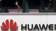 The Latest: Germans, Dutch won't ban Huawei despite US move