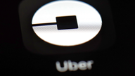 Uber shifts into lower gear, prices IPO at $45