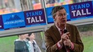 John Hickenlooper says he believes in capitalism