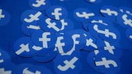 Facebook's new digital currency faces early uphill battle with regulators