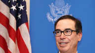 The Latest: Mnuchin to hold 1-on-1 chat with PBOC Gov. Yi