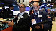 Stocks post small losses; investors look ahead to Fed