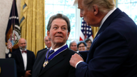Trump honors economist who advised him on lowering taxes