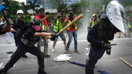 Hong Kong protesters sprayed with tear gas after ripping down ‘smart lampposts’
