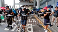 Hong Kong airport service disrupted after violent protests suspend nearby trains, buses and roads