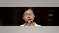 Hong Kong leader says new US law, violence will harm economy