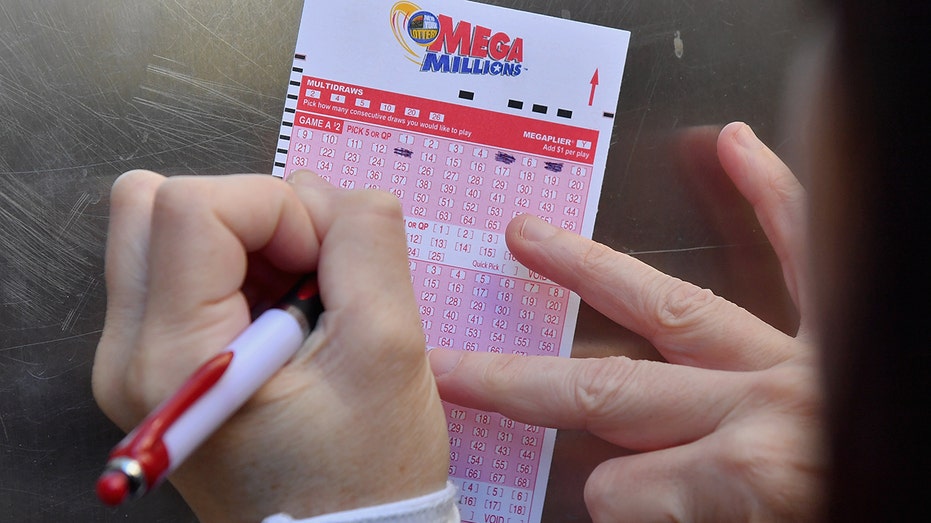 The player fills out a Mega Millions ticket