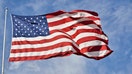 An XXXL American flag against an idylllic sky with fluffy clouds. - Fox Business News