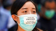 Hong Kong protesters defy mask ban with bricks and gas bombs