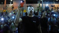 Protesters charged in violence following Hong Kong's new mask ban