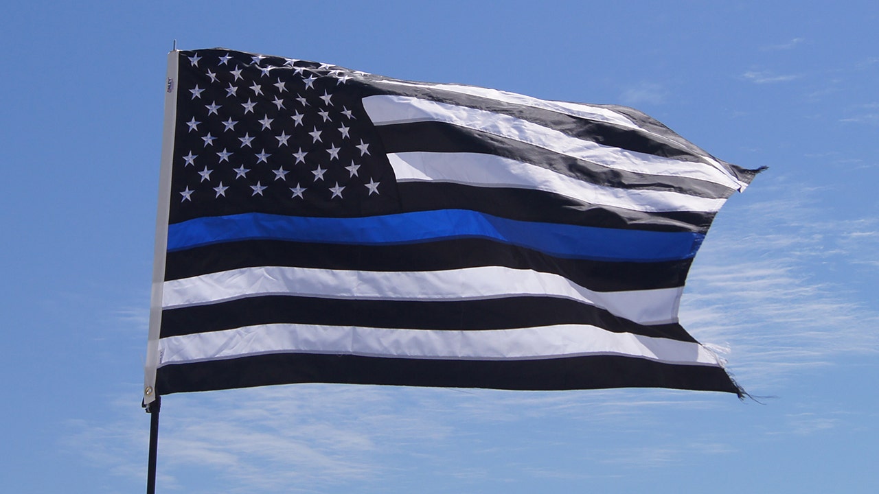 Woodworker's 'thin blue line' flag sparks controversy.