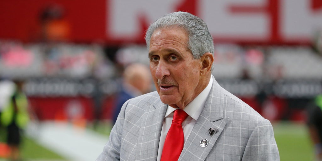 Atlanta Falcons owner Arthur Blank models a new Falcons' jersey during a  press conference and fashion show at the Mall of Georgia in Buford, Ga.,  Thursday, April 24, 2003. The Falcons unveiled