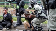 Hong Kong police battle protesters trying to escape arrest