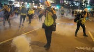 Hong Kong protesters vandalize subway station, storm mall