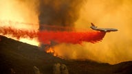 Rain may douse California wildfire threatening homes