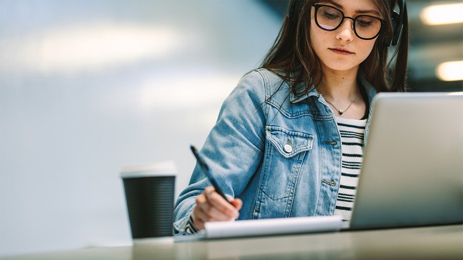 person at laptop with coffee