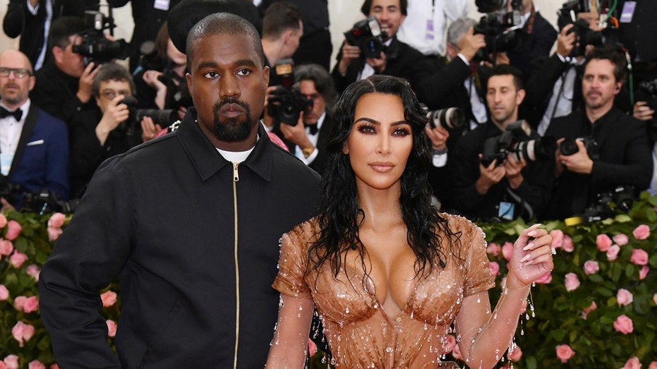 Kanye West, left, and Kim Kardashian