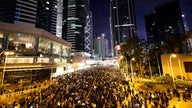 Hundreds of thousands march as Hong Kong protests near half-year mark