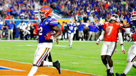Perine leads No. 6 Gators past Virginia 36-28 in Orange Bowl