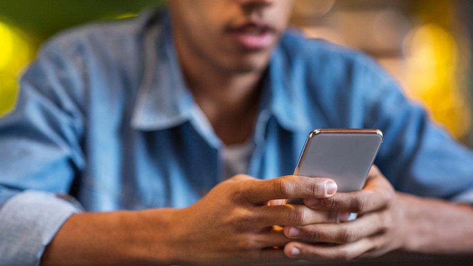 Man looking smartphone cellphone