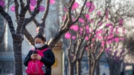 Coronavirus cases in China top SARS as evacuations begin
