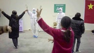 Coronavirus patients use dance to stay positive in Chinese hospital