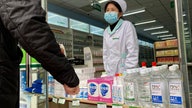 China's virus cases fall, deaths rise, but count revised again