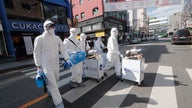 Coronavirus 'damaging' world economy as outbreak nears 60 countries