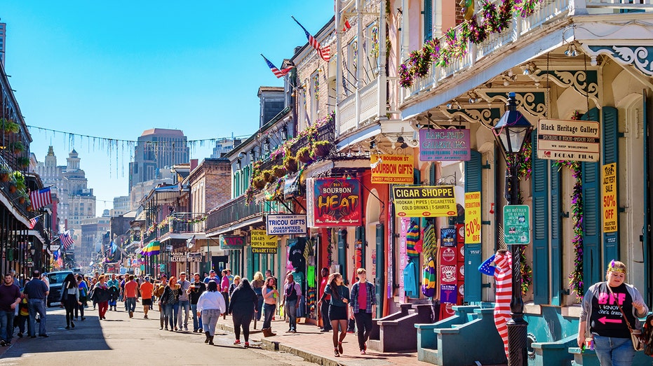 Bourbon Street in the French Quarter of New Orleans during Mardi Gras. (iSt...