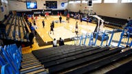 NCAA hoops game in Baltimore held in empty gym for COVID-19