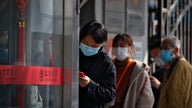 Chinese province at coronavirus center lets some companies reopen