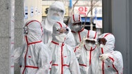Virus alarms sound worldwide, but China sees crisis ebbing