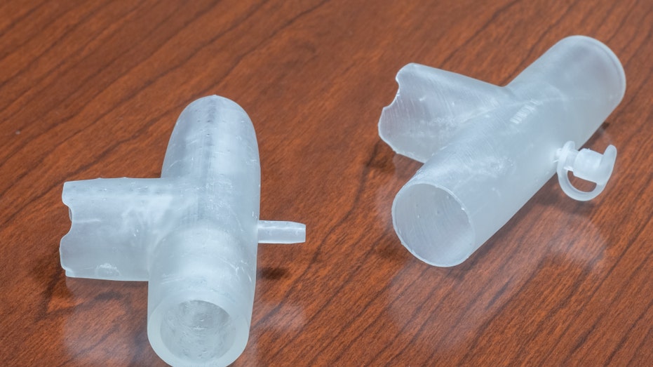 Drs. Stanley John, Hugh Cassiere and Todd Goldstein collaborated on turning BiPAP machines into backup ventilators and fitting them with 3D-printed adaptors (pictured). Photo: Northwell Health