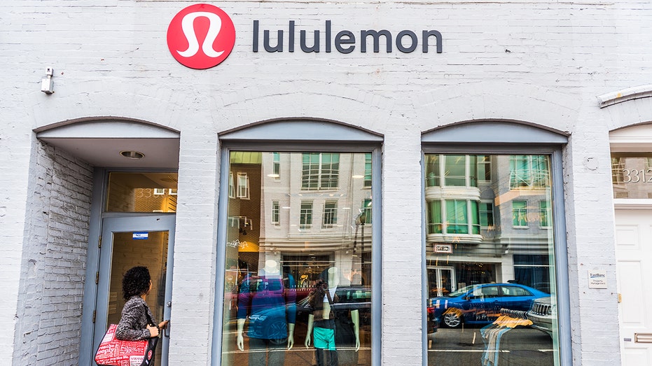 Woman entering a Lululemon store in D.C.
