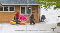 Thousands in Michigan evacuated as river dams break, flood communities