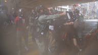 Hong Kong police fire tear gas, water cannon at protesters
