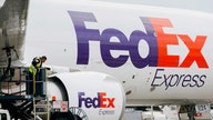 FedEx closing stores, offices, delaying hires, pulls forecast