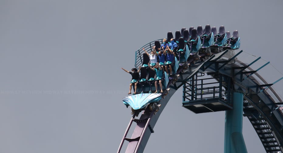 Thrill seekers at SeaWorld Orlando strap on masks before boarding