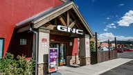 Vitamin chain GNC files for bankruptcy, may close 1,200 stores, sell