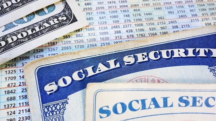 Social Security cards with cash and benefit amount numbers - Fox Business News