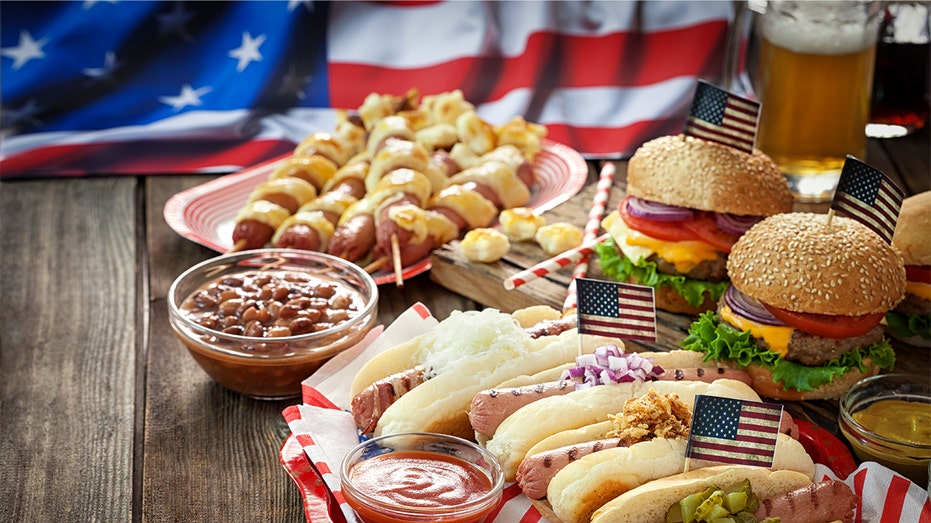 Hot dogs and burgers in front of an American flag