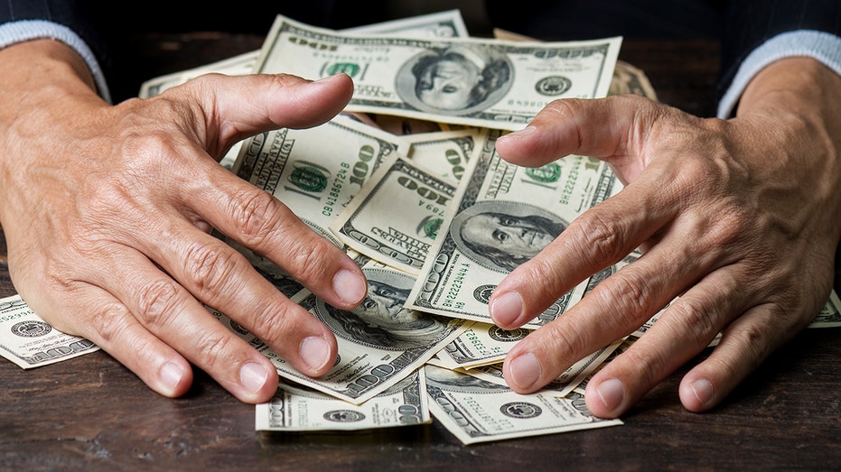 Man's hands holding money