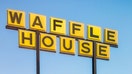 &quot;Davenport, USA - March 8, 2013: Waffle House Roadside Restaurant with Sign located in Davenport, Florida. Some people can be seen eating through the restaurant&apos;s windows.&quot;