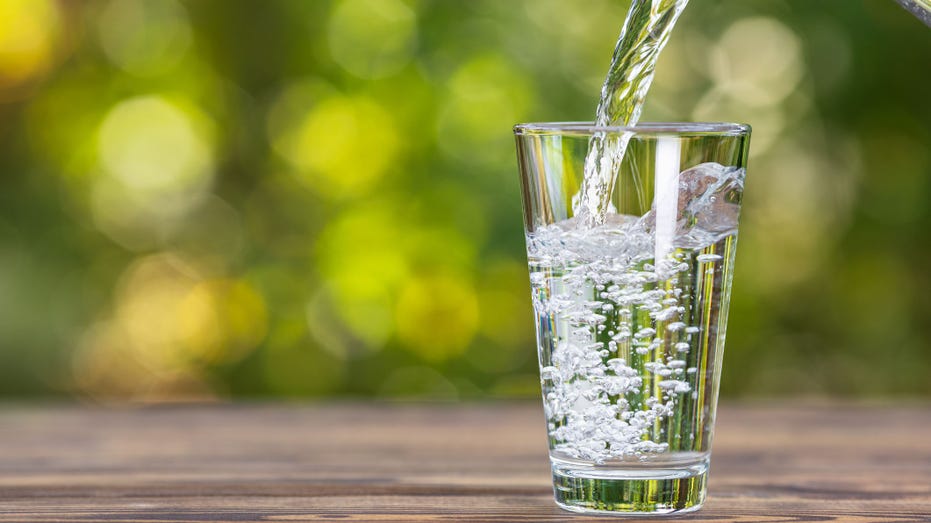 Water flows into the glass
