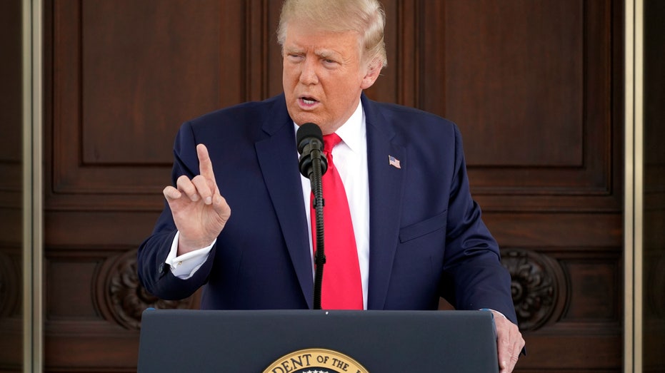 Donald Trump speaking at podium