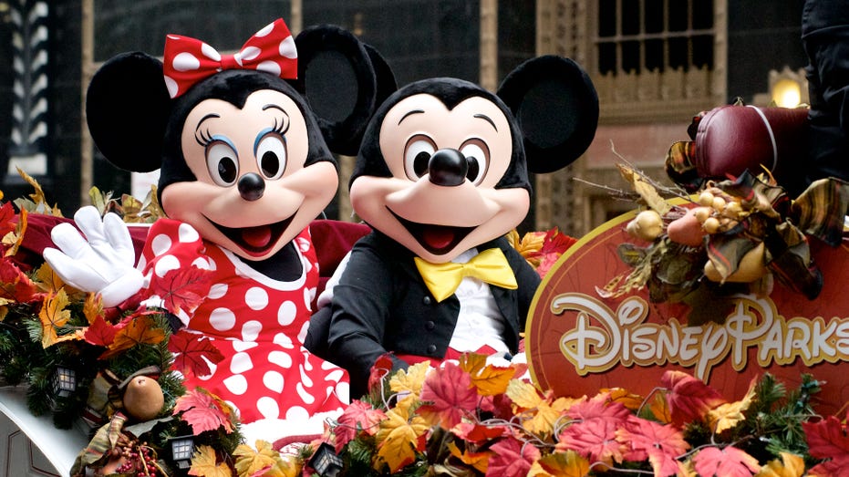 Minnie and Mickey Mouse ride Disney Parks float