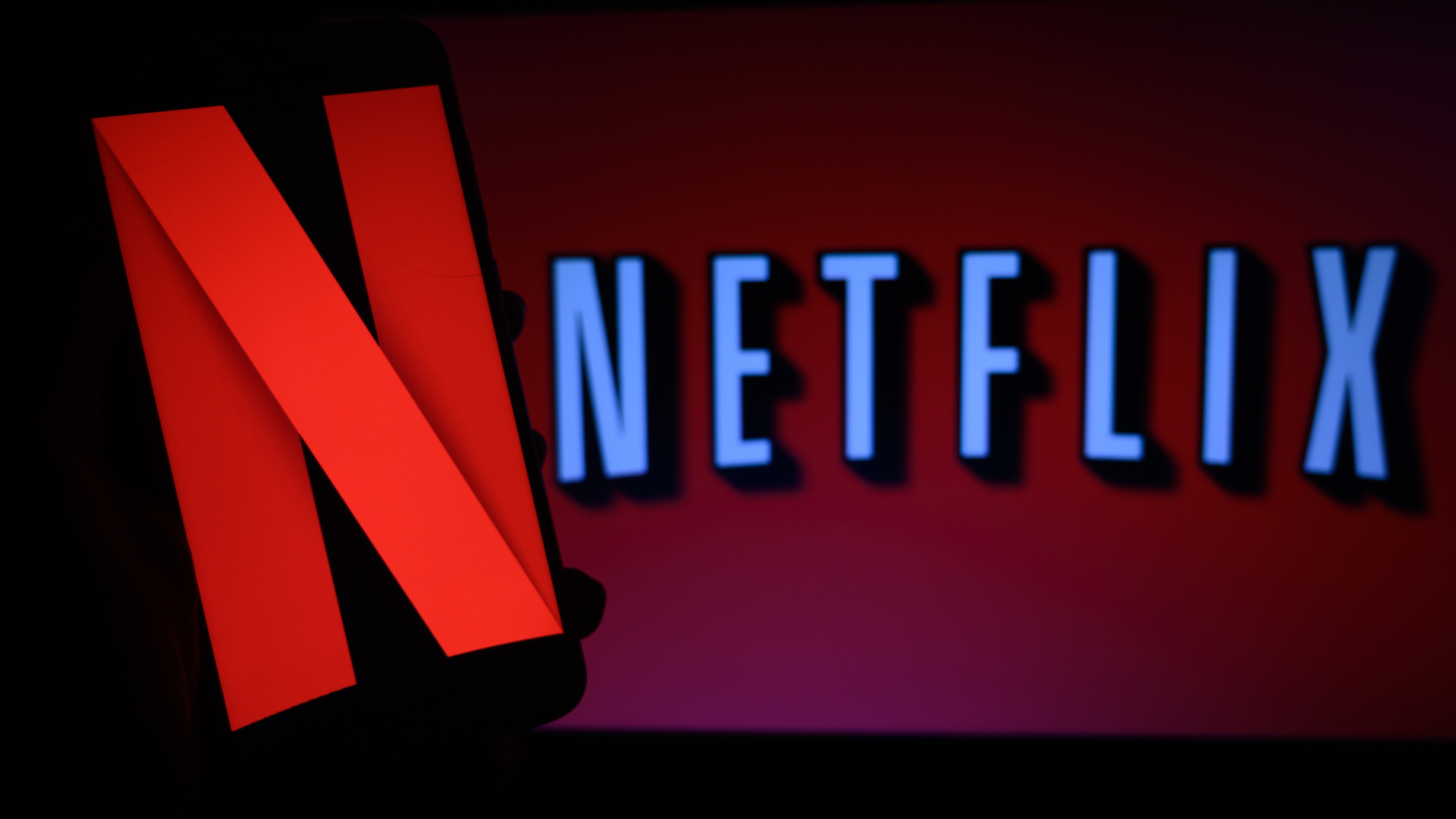 Netflix scaling back movie output, cuts jobs in restructuring